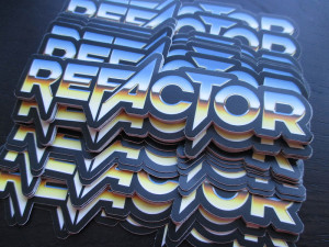 A stack of stickers showing the word 'refactor' in a stylised, death-metal-like font.