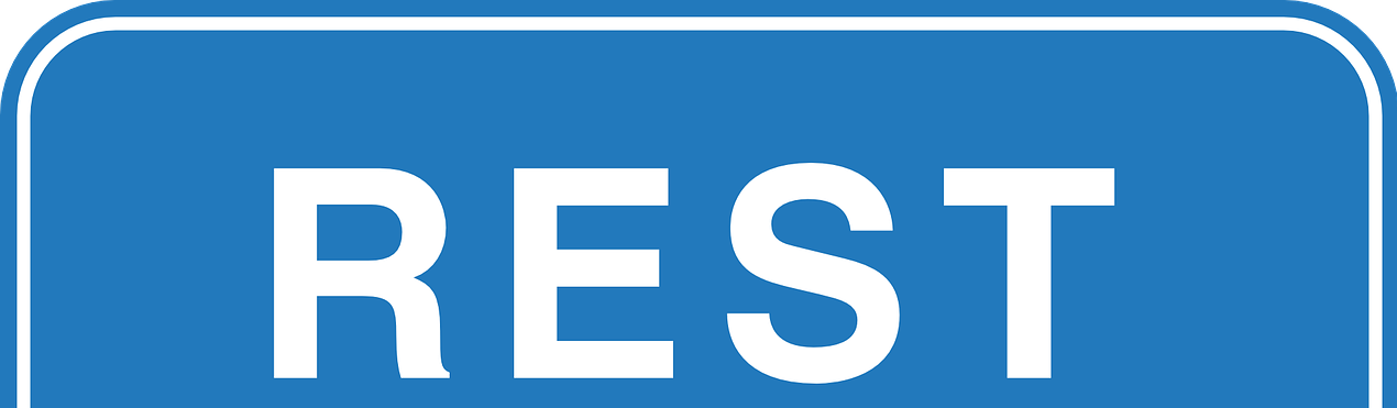 Top of a blue sign with the word 'REST'