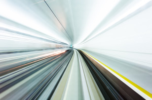 A bright photo taken using a slow exposure in a train tunnel, giving the impression of moving at warp speed, such as in the topic of Cameron Barrie's Mobile talk.