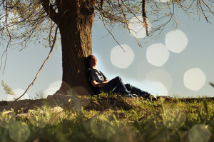 Man lying under a tree daydreaming about the future. Proabably not what you'd call "too agile"