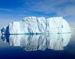 An antarctic iceberg which, much like distributed transactions in microservices, can be hard to see and can wreck your ship.