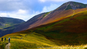 Hikers starting up a long steep climb