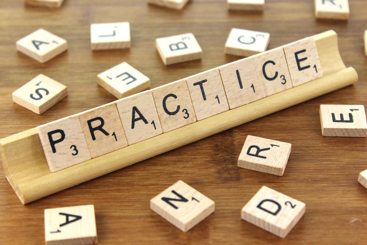 The word 'practice' spelt out using scrabble letters. Exercism.io is a great website for practising with different programming languages.